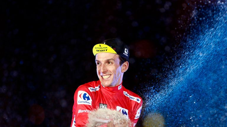 Simon Yates sprays champagne after winning the 2018 Vuelta a Espana