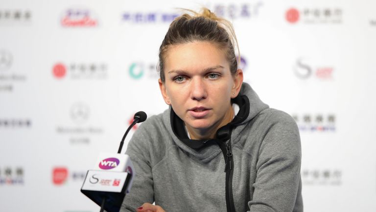 Simona Halep speaks to the media after retiring from her match in Beijing