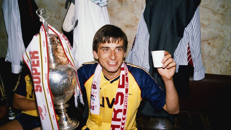 Smith celebrates with the League Division One trophy after beating Liverpool in 1989