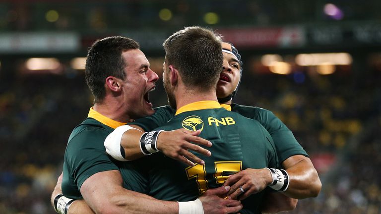 Cheslin Kolbe, Willie Le Roux, Jesse Kriel celebrate South Africa's victory over New Zealand in the Rugby Championship