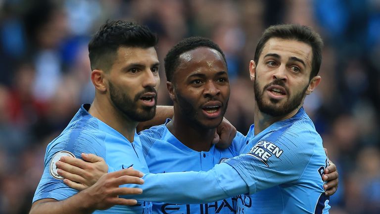 Raheem Sterling celebrates with his Manchester City teammates after scoring against Brighton.