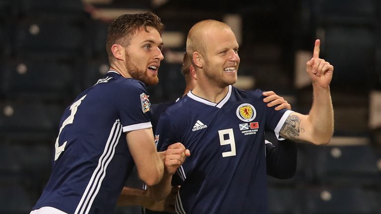 Steven Naismith celebrates after his header was turned into his own goal by Albania defender Berat Djimsiti