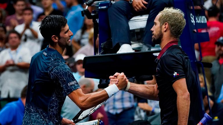 Novak Djokovic (left) shakes hands with Richard Gasquet after winning their US Open match