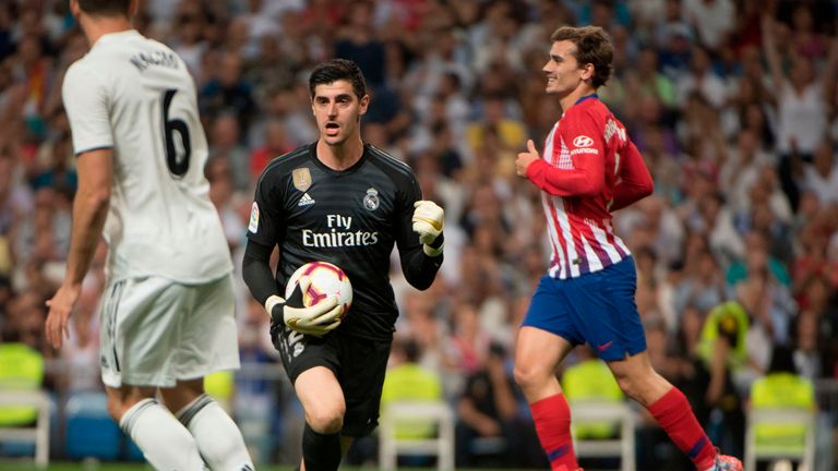 Thibaut Courtois reacts after making a fine save from Antoine Griezmann's effort