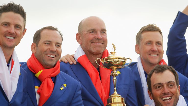 Bjorn poses alongside Sergio Garcia with the trophy