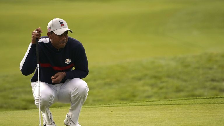 US golfer Tiger Woods lines up a putt  during his fourball match on the first day of the 42nd Ryder Cup at Le Golf National Course at Saint-Quentin-en-Yvelines, south-west of Paris on September 28, 2018. (Photo by Lionel BONAVENTURE / AFP)        (Photo credit should read LIONEL BONAVENTURE/AFP/Getty Images)