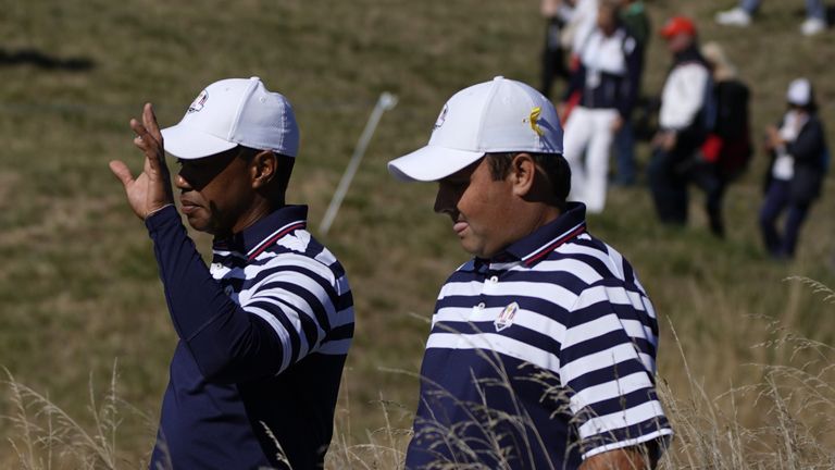 US golfer Tiger Woods (L) gestures as he speaks with US golfer Patrick Reed during a practice session ahead of the 42nd Ryder Cup at Le Golf National Course at Saint-Quentin-en-Yvelines, south-west of Paris on September 26, 2018. 
