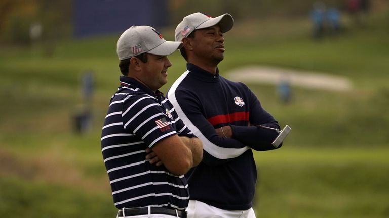 US golfer Tiger Woods (R) and US golfer Patrick Reed react during their fourball match on the first day of the 42nd Ryder Cup at Le Golf National Course at Saint-Quentin-en-Yvelines, south-west of Paris on September 28, 2018. (Photo by Lionel BONAVENTURE / AFP)        (Photo credit should read LIONEL BONAVENTURE/AFP/Getty Images)