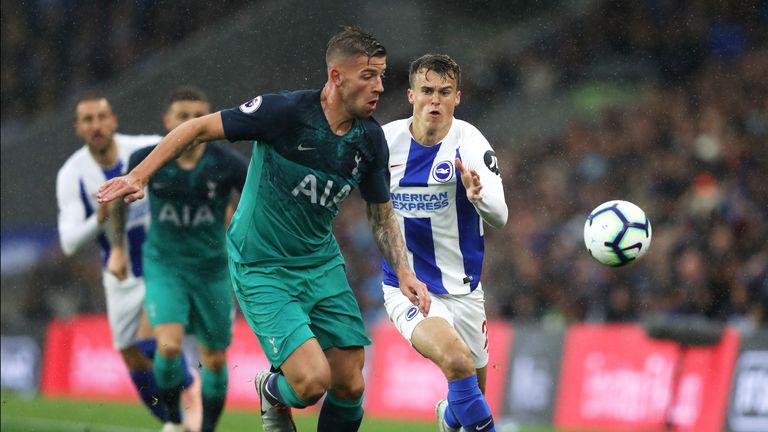 Solly March and and Toby Alderweireld in action at the Amex Stadium