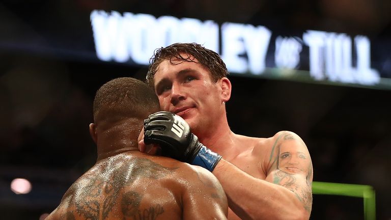 Tyron Woodley and Darren Till embrace after their welterweight Title bout at UFC 228