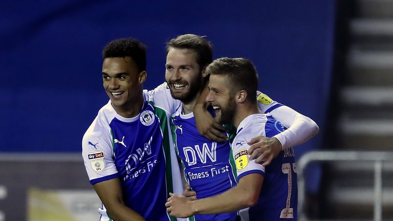 Wigan Athletic's Nick Powell (centre) celebrates scoring his side's first goal of the game v Bristol City with Michael Jacobs (right) during the Sky Bet Championship match at the DW Stadium, Wigan