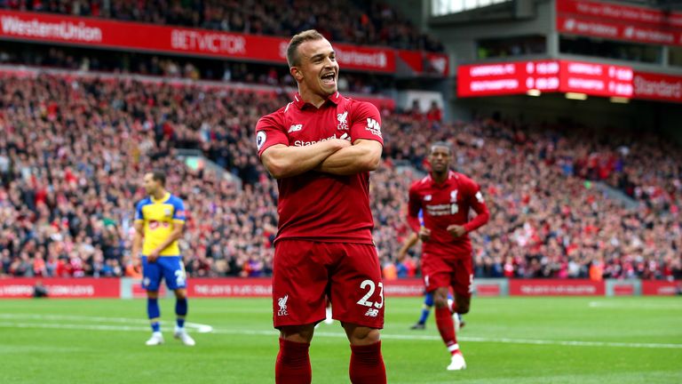 Xherdan Shaqiri of Liverpool celebrates after he provides the assist for Liverpool&#39;s first goal
