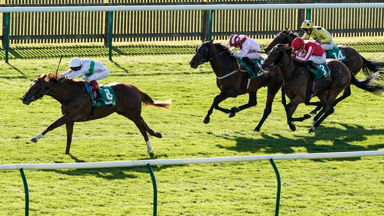 Frankie Dettori riding Wissahickon (left) wins the bet365 Cambridgeshire Handicap Stakes at Newmarket 
