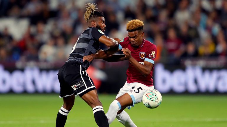 Tyrone Marsh battles for possession with Grady Diangana