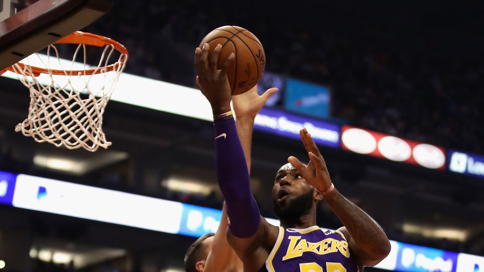 LeBron James throws himself off-the-backboard pass before scoring ...