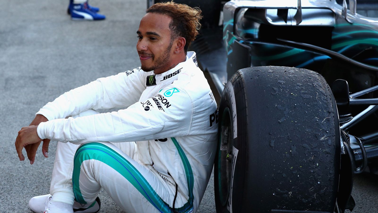 F1 Drivers sit in car