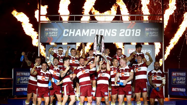 Wigan lift the Super League trophy after winning the Grand Final against Warrington 