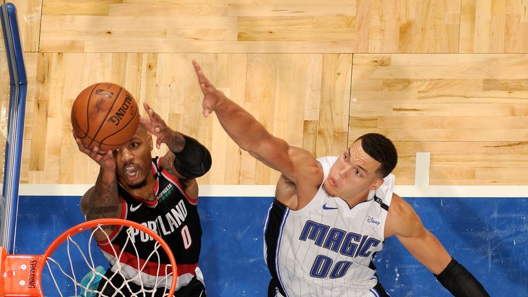 Damian Lillard attacks the basket against the Orlando Magic