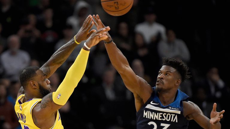 Jimmy Butler blocks a LeBron James shot