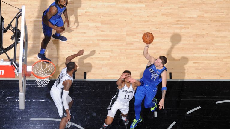 Luka Doncic lofts a floater against San Antonio