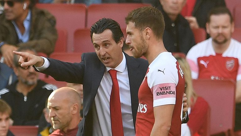 Aaron Ramsey of Arsenal gets instructions from Arsenal Head Coach Unai Emery during the Premier League match between Arsenal FC and Watford FC at Emirates Stadium on September 29, 2018 in London, United Kingdom.