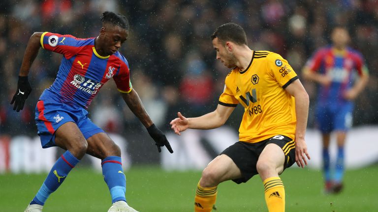 Aaron Wan-Bissaka of Crystal Palace is challenged by Diogo Jota of Wolverhampton Wanderers