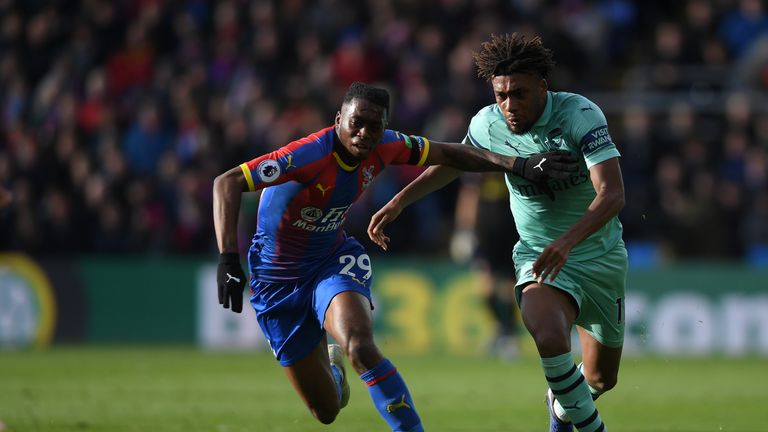 Crystal Palace defender Aaron Wan-Bissaka  holds off Arsenal's Alex Iwobi 