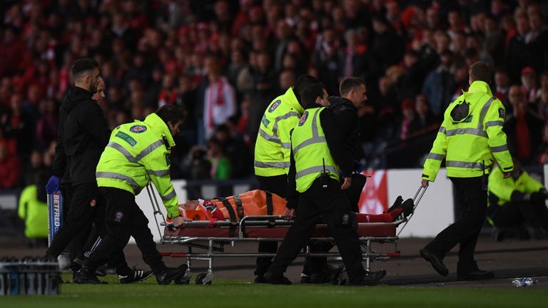 Aberdeen's Andrew Considine is stretchered off