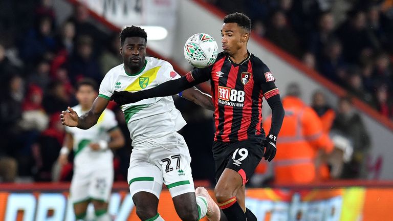 Alexander Tettey (L) vies with Bournemouth midfielder Junior Stanislas during the Carabao Cup fourth-round match between Bournemouth and Norwich City 
