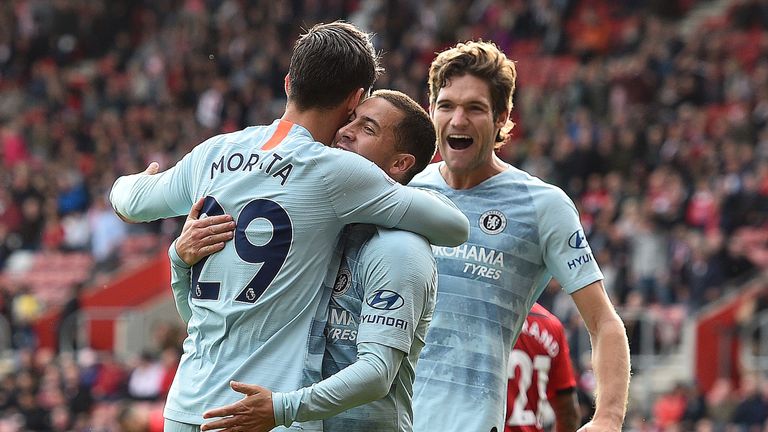 Alvaro Morata celebrates with Eden Hazard and Marcos Alonso after scoring Chelsea's third goal of the game