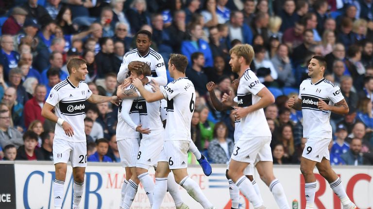 Fulham's Andre Schurrle (second left) celebrates scoring his side's first goal