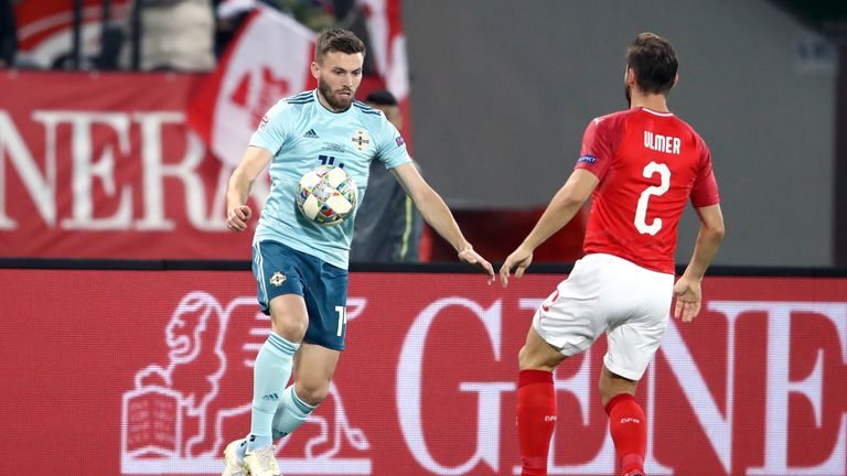 Austria's Andreas Ulmer (right) and Northern Ireland's Stuart Dallas battle for the ball