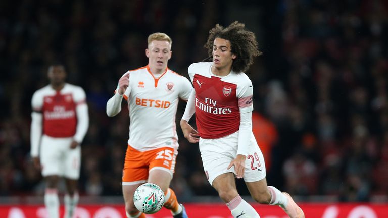 Arsenal's Matteo Guendouzi (right) and Blackpool's Callum Guy battle for the ball during the Carabao Cup, Fourth Round match at the Emirates Stadium, London.