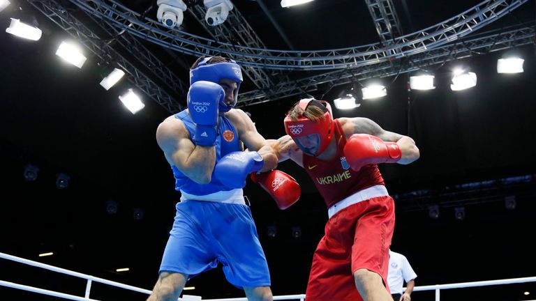 Oleksandr Usyk (R) of the Ukraine defends against Artur Beterbiev (L) of Russia in quaterfinals Heavyweight (91kg) boxing of the 2012 London Olympic Games