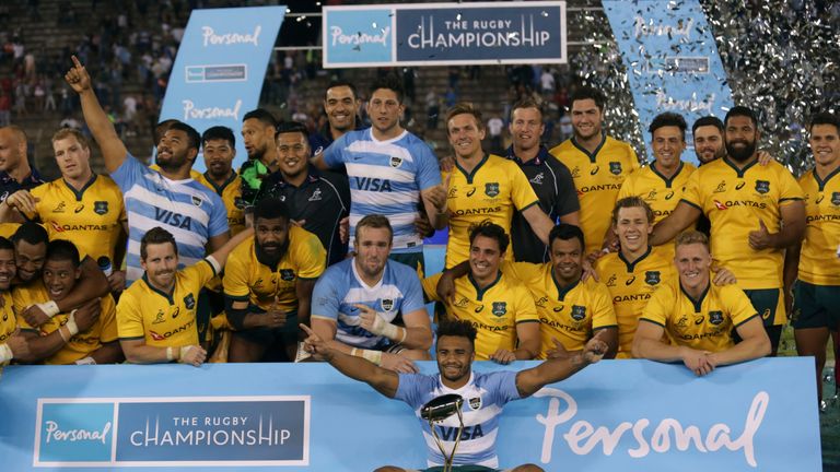 Australia celebrate with the trophy after their remarkable comeback