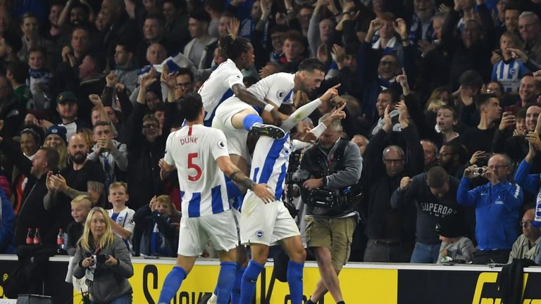 Glenn Murray of Brighton and Hove Albion celebrates with team-mates after scoring his team's first goal during the Premier League match between Brighton & Hove Albion and West Ham United at American Express Community Stadium on October 5, 2018 in Brighton, United Kingdom