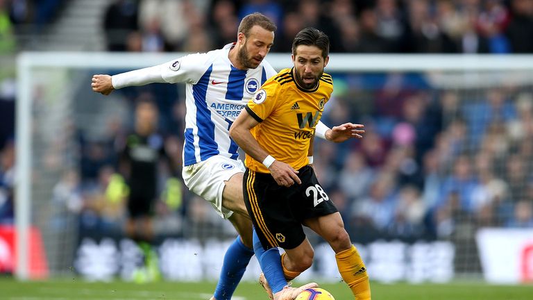 Joao Moutinho of Wolverhampton Wanderers is challenged by Glenn Murray of Brighton and Hove Albion 