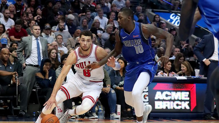 Zach LaVine #8 of the Chicago Bulls drives to the basket against Dorian Finney-Smith #10 of the Dallas Mavericks in the second half at American Airlines Center on October 22, 2018 in Dallas, Texas.