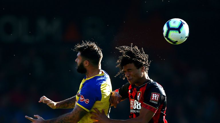 Charlie Austin and Nathan Ake in action at the Vitality Stadium
