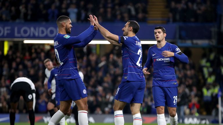 Chelsea's Ruben Loftus-Cheek (left) and Davide Zappacosta celebrate after Derby County's Fikayo Tomori scores an own goal during the Carabao Cup, Fourth Round match at Stamford Bridge, London