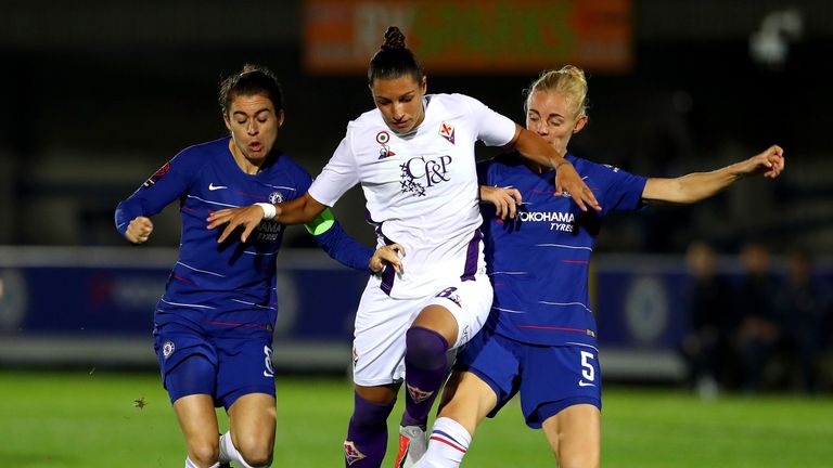 Alice Parisi of Fiorentina is challenged by Sophie Ingle of Chelsea Women and Karen Carney during the UEFA Women's Champions League Round of 16 1st Leg match between Chelsea Women and Fiorentina Women at The Cherry Red Records Stadium on October 17, 2018 in Kingston upon Thames, England.