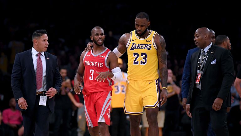 Chris Paul #3 of the Houston Rockets and Rajon Rondo #9 of the Los Angeles Lakers fight during a 124-115 Rockets win at Staples Center on October 20, 2018 in Los Angeles, California.