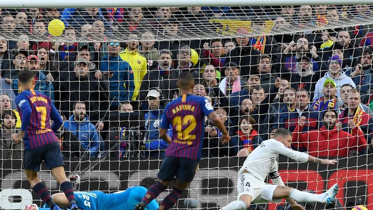 Philippe Coutinho guides the ball into the net to give Barcelona the lead