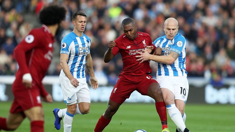 Daniel Sturridge tussles with Aaron Mooy at the John Smith's Stadium
