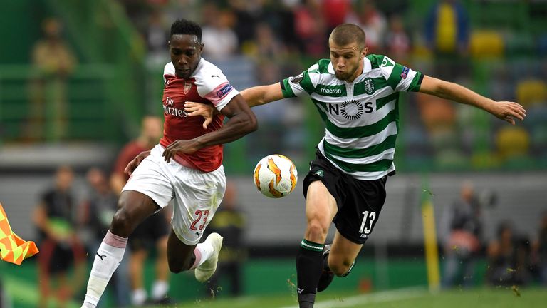 Danny Welbeck of Arsenal and Stefan Ristovski of Sporting CP clash during the UEFA Europa League Group E match