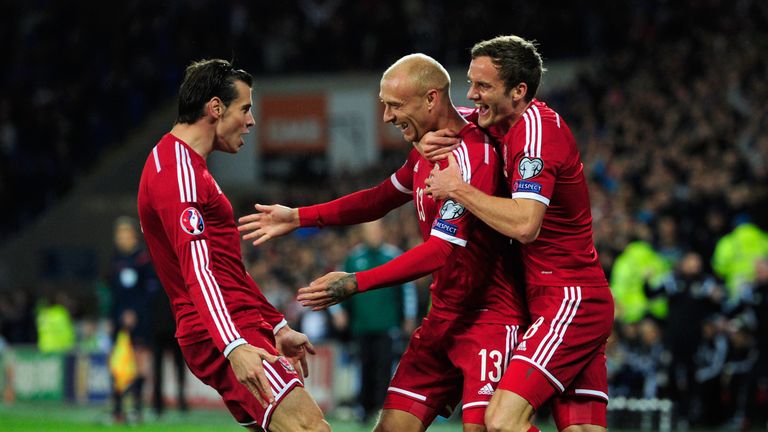 David Cotterill celebrates his opening goal with Gareth Bale and Andy King during the EURO 2016 Qualifier match between Wales and Cyprus at Cardiff City Stadium on October 13, 2014.