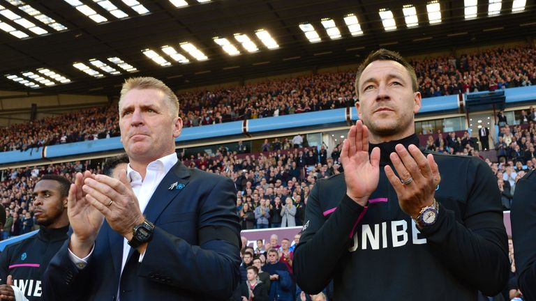 Aston Villa head coach Dean Smith and assistant John Terry during the minute's applause for the late Sir Doug Ellis at Villa Park,