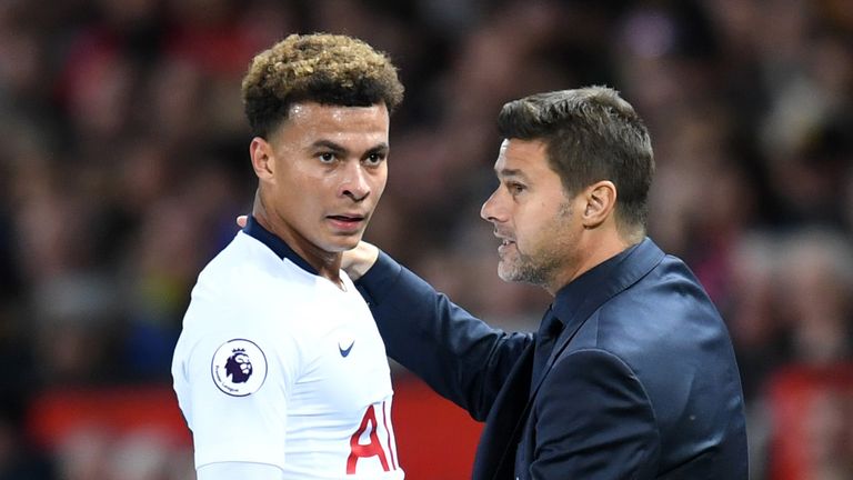 Mauricio Pochettino, Manager of Tottenham Hotspur speaks to Dele Alli of Tottenham Hotspur during the Premier League match between Manchester United and Tottenham Hotspur at Old Trafford on August 27, 2018 in Manchester, United Kingdom