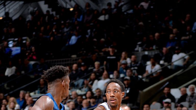 SAN ANTONIO, TX - OCTOBER 17: DeMar DeRozan #10 of the San Antonio Spurs handles the ball against Jimmy Butler #23 of the Minnesota Timberwolves during a game on October 17, 2018 at the AT&T Center in San Antonio, Texas. 