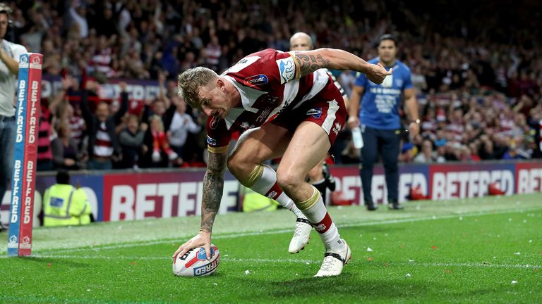 Wigan Warriors' Dominic Manfredi scores his team's first try during the Betfred Super League Grand Final at Old Trafford, Manchester.